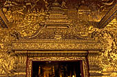 Luang Prabang, Laos - Wat Mai, the gilded stucco engravings of the veranda. 